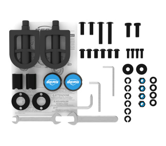 Bicycle pedal installation kit with two pedals, fasteners, wrenches, and an instruction sheet laid out on white background.